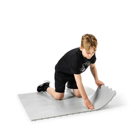 Snap-together floorball training tiles laid out in a home training area